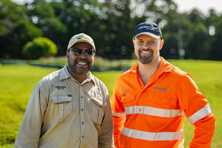 A representative of the Djabugay Traditional Owners and CleanCo Director Retail, Rimu Nelson in high vis, smile at the camera
