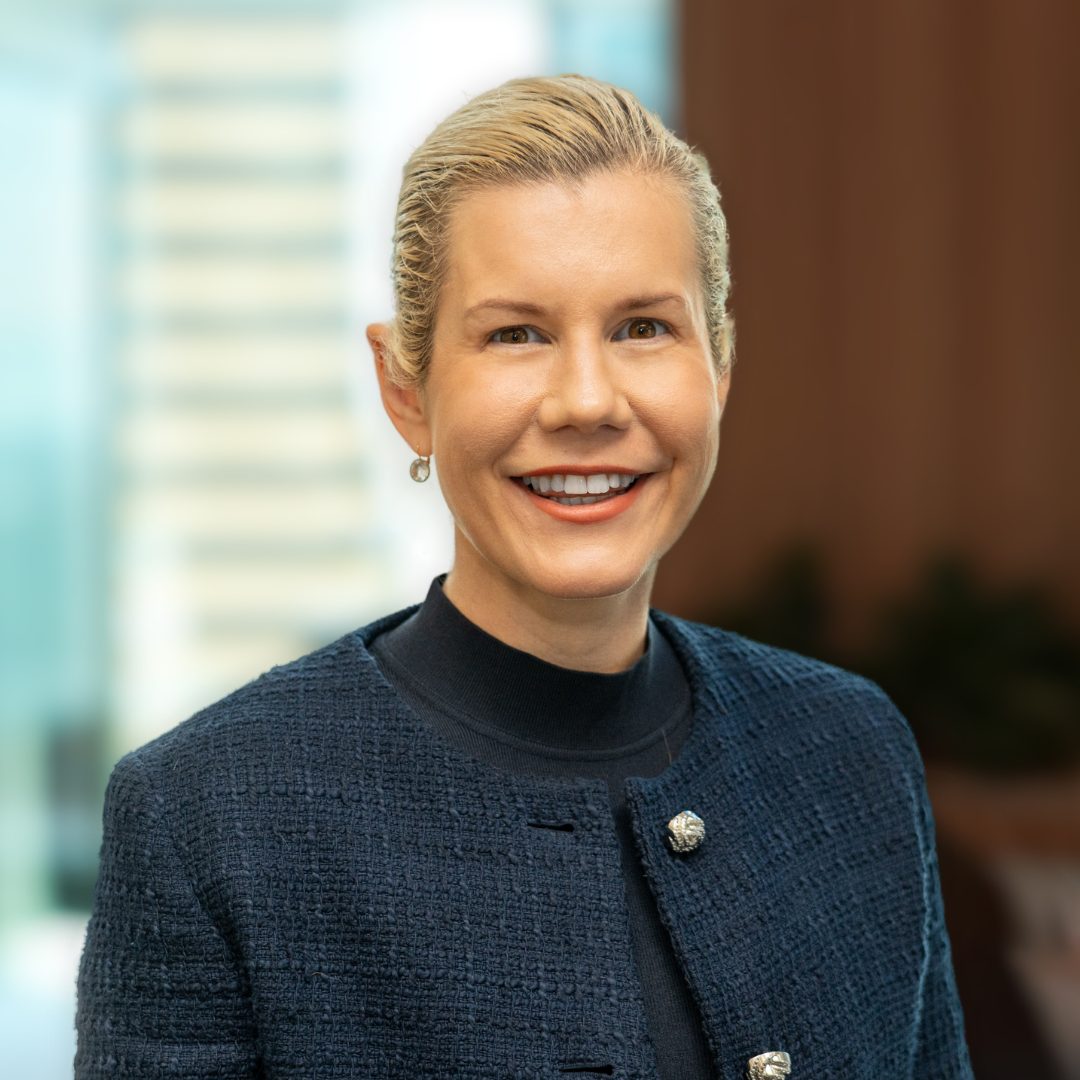A photograph of CleanCo's Chief People Officer (Acting), Kate Wright, smiling at the camera