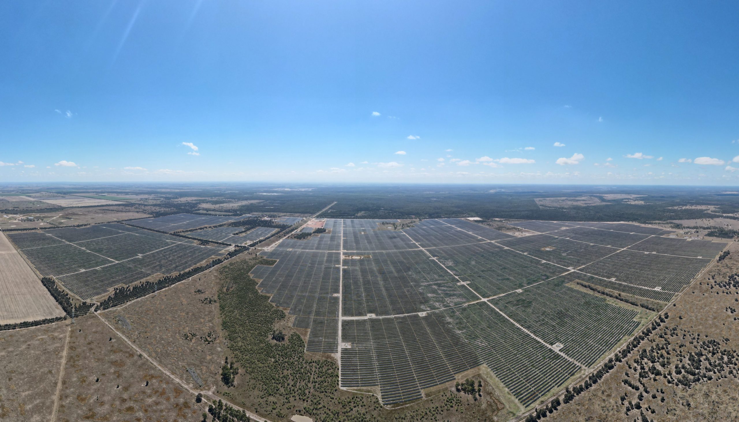 An aerial photograph of the Western Down Green Power Hub Solar Farm on a bright sunny day.